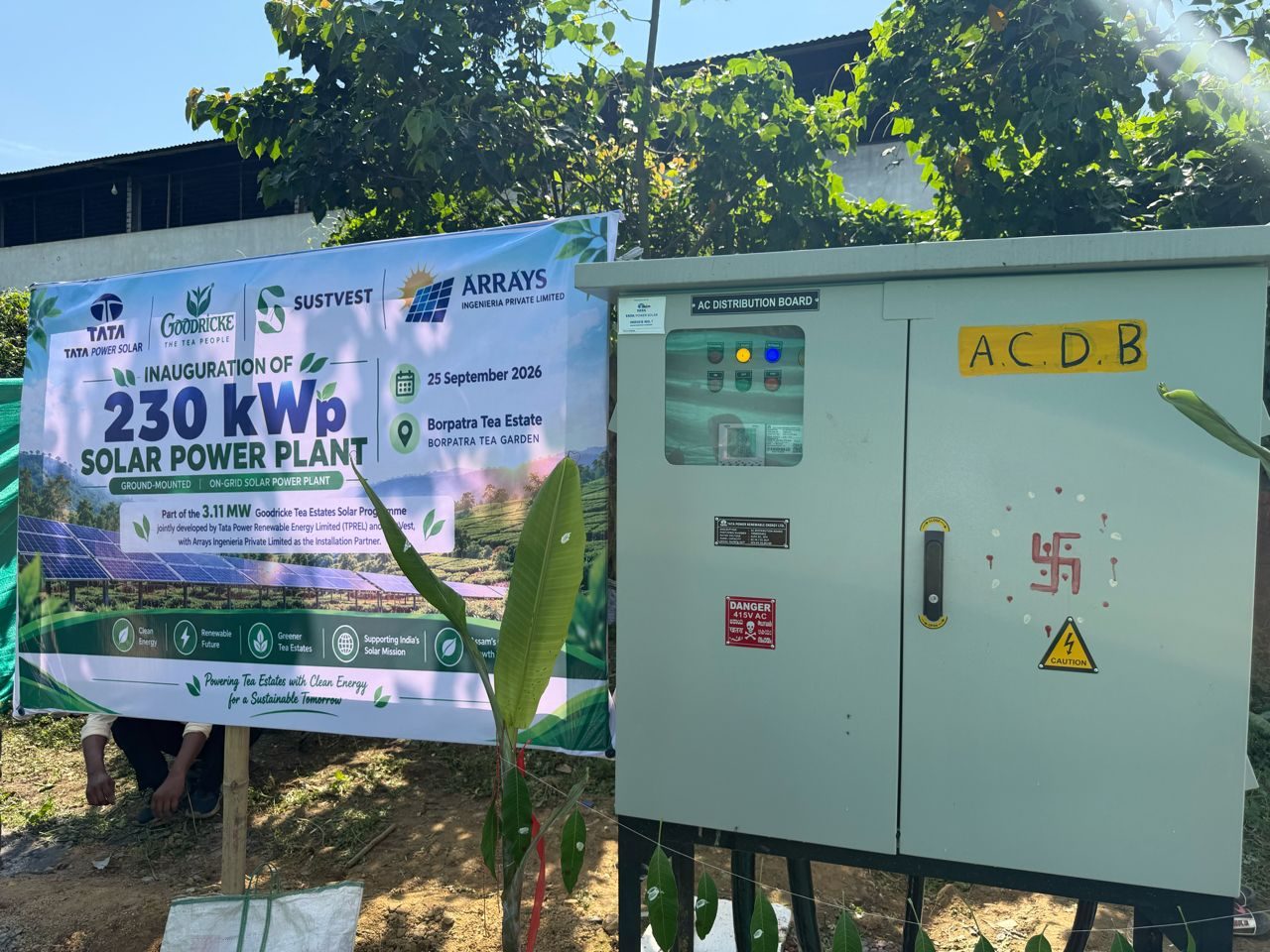 Inauguration banner beside the AC distribution board (ACDB) of the 230 kWp Borpatra Tea Estate solar plant, Arrays Ingenieria